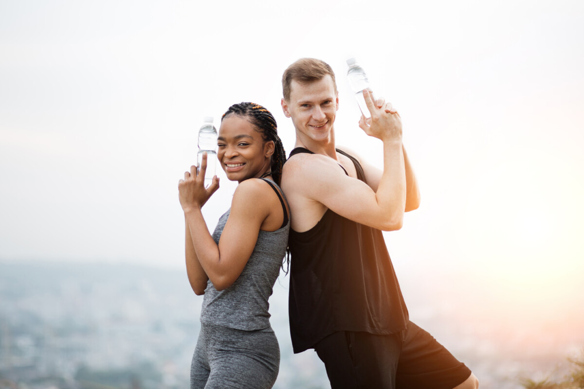 Man and woman looking strong and confident, representing a sustainable health plan built through strength training and consistent habits.