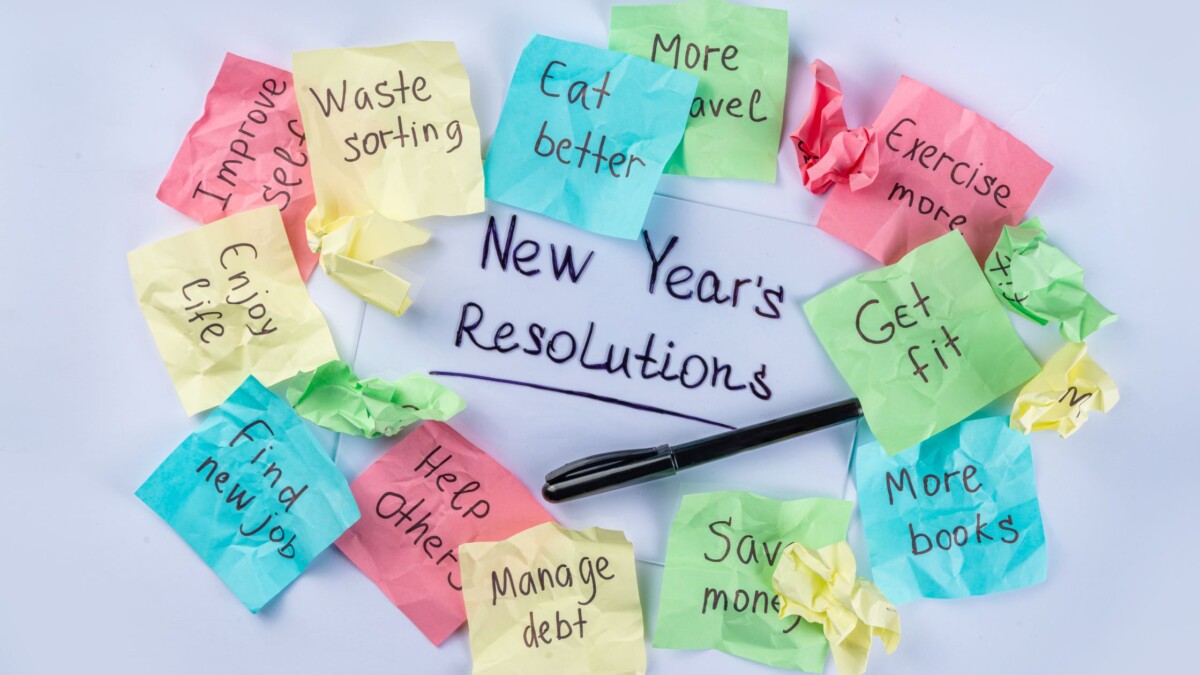 New Year resolutions written on sticky notes representing intentions vs resolutions
